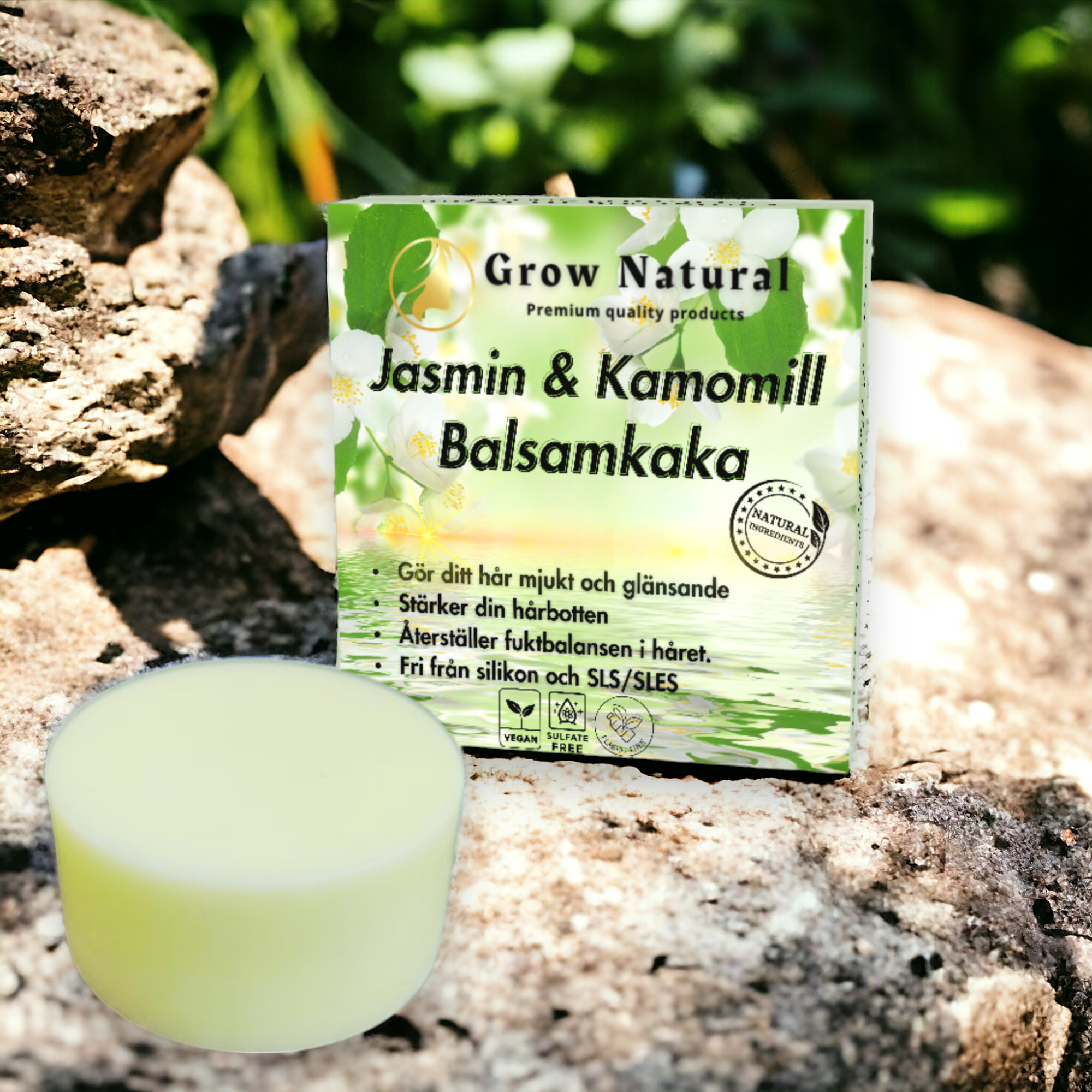 Grow Natural™ – Jasmin & Kamomill Balsam – förpackning omgiven av jasmin och kamomill